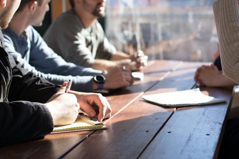 People are discussing around a table