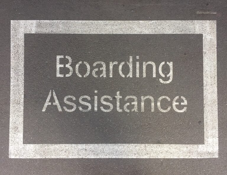 A sign saying 'boarding assistance'